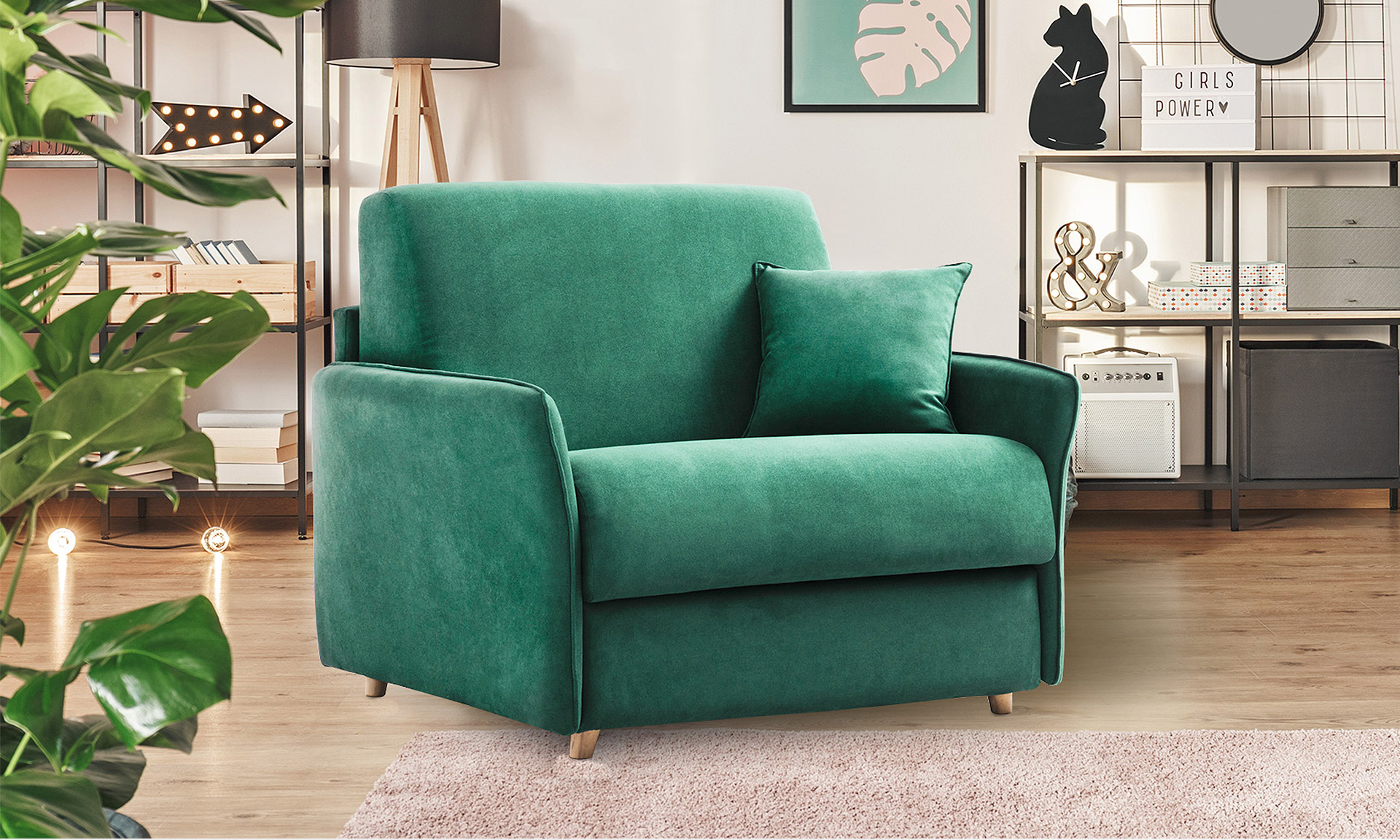 Fauteuil convertible 1 place en daim vert émeraude avec passepoil de la même couleur. Il est fermé avec un coussin vert vert émeraude